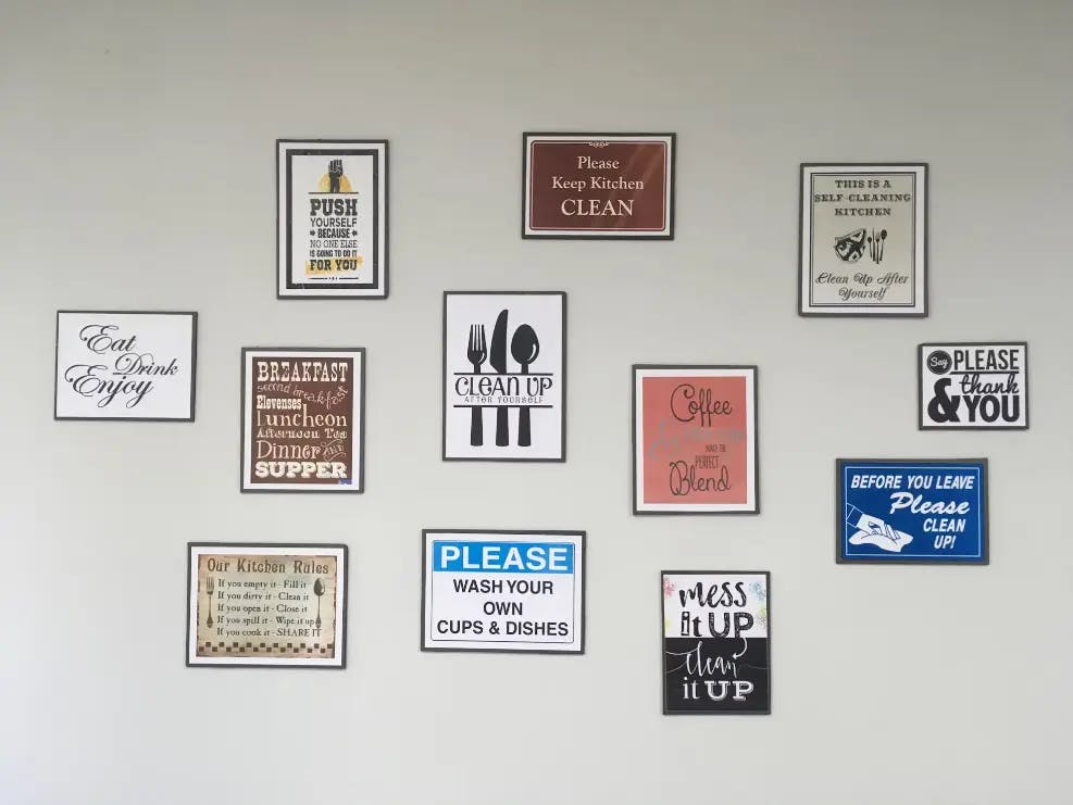 Frames with various quotes arranged on a wall